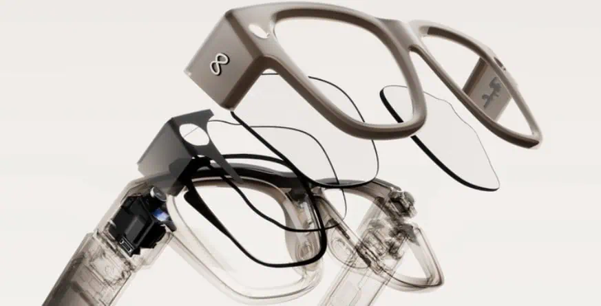 Vista esplosa degli occhiali intelligenti Meta che mostra i componenti interni e la struttura a strati delle lenti.
