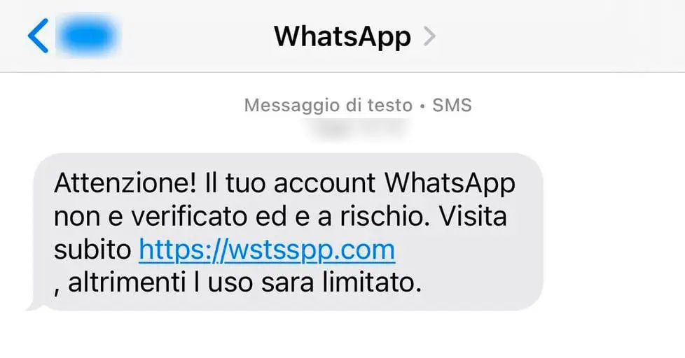 SMS truffa avvisa che l'account WhatsApp è a rischio e invita l'utente a cliccare su un link sospetto per la verifica dell'account non verificato.