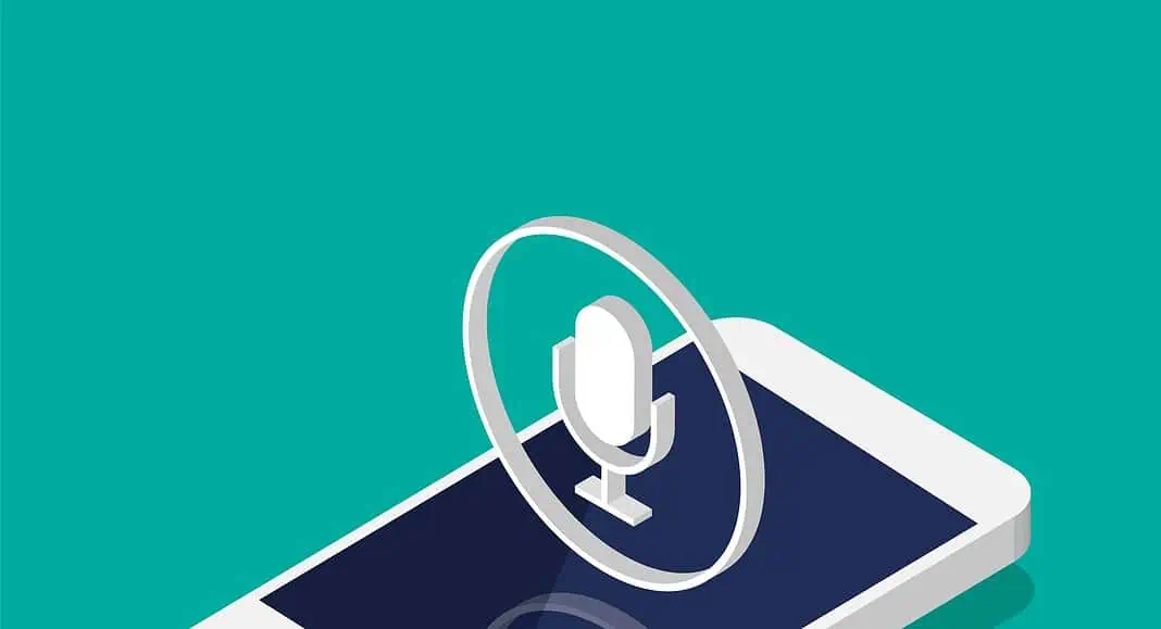 Smartphone isometrico con una grande icona a forma di microfono sopra lo schermo, che simboleggia la registrazione vocale, l'assistente vocale o la condivisione di audio su Instagram.
